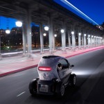Renault Twizy Electric Car - Rear view, driving through streets